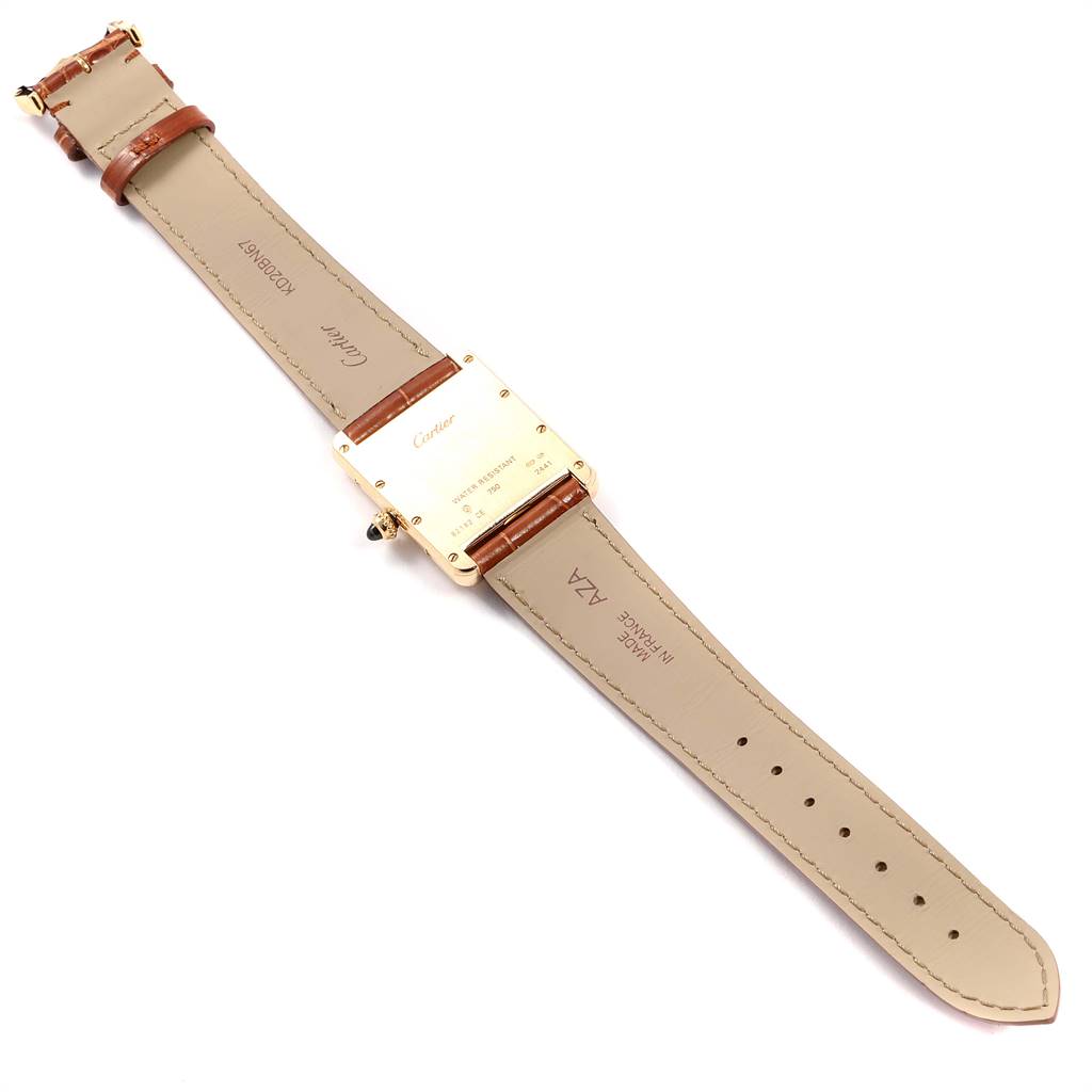 The image shows the back side of a Cartier Tank Louis W1529756 Men
s Yellow Gold Silver Dial W1529756 Men
s Yellow Gold Silver Dial watch, including the case back, leather straps, and buckle.