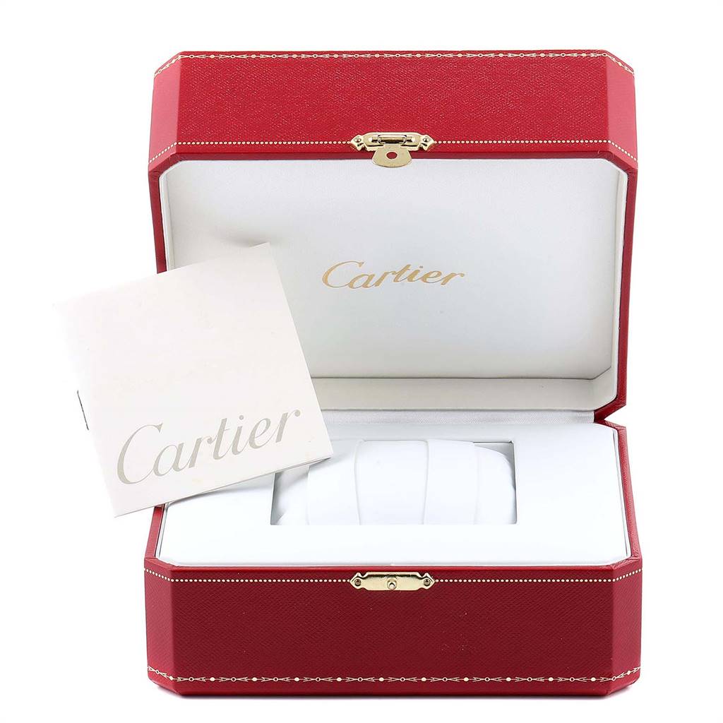 The image shows an open red Cartier watch box and booklet for a Tank Louis model.