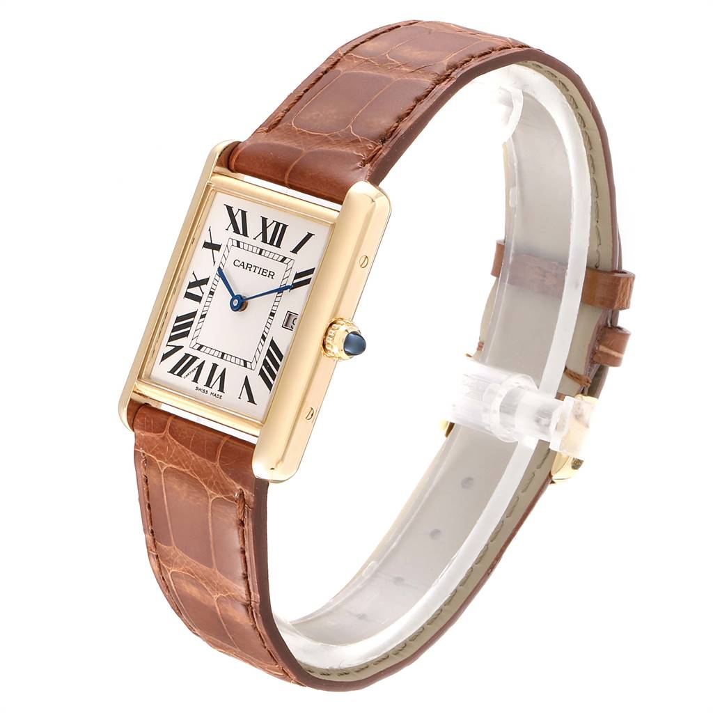 The image shows a Cartier Tank Louis W1529756 Men
s Yellow Gold Silver Dial W1529756 Men
s Yellow Gold Silver Dial watch at a three-quarter angle, highlighting its rectangular face, leather strap, and crown with a blue gem.