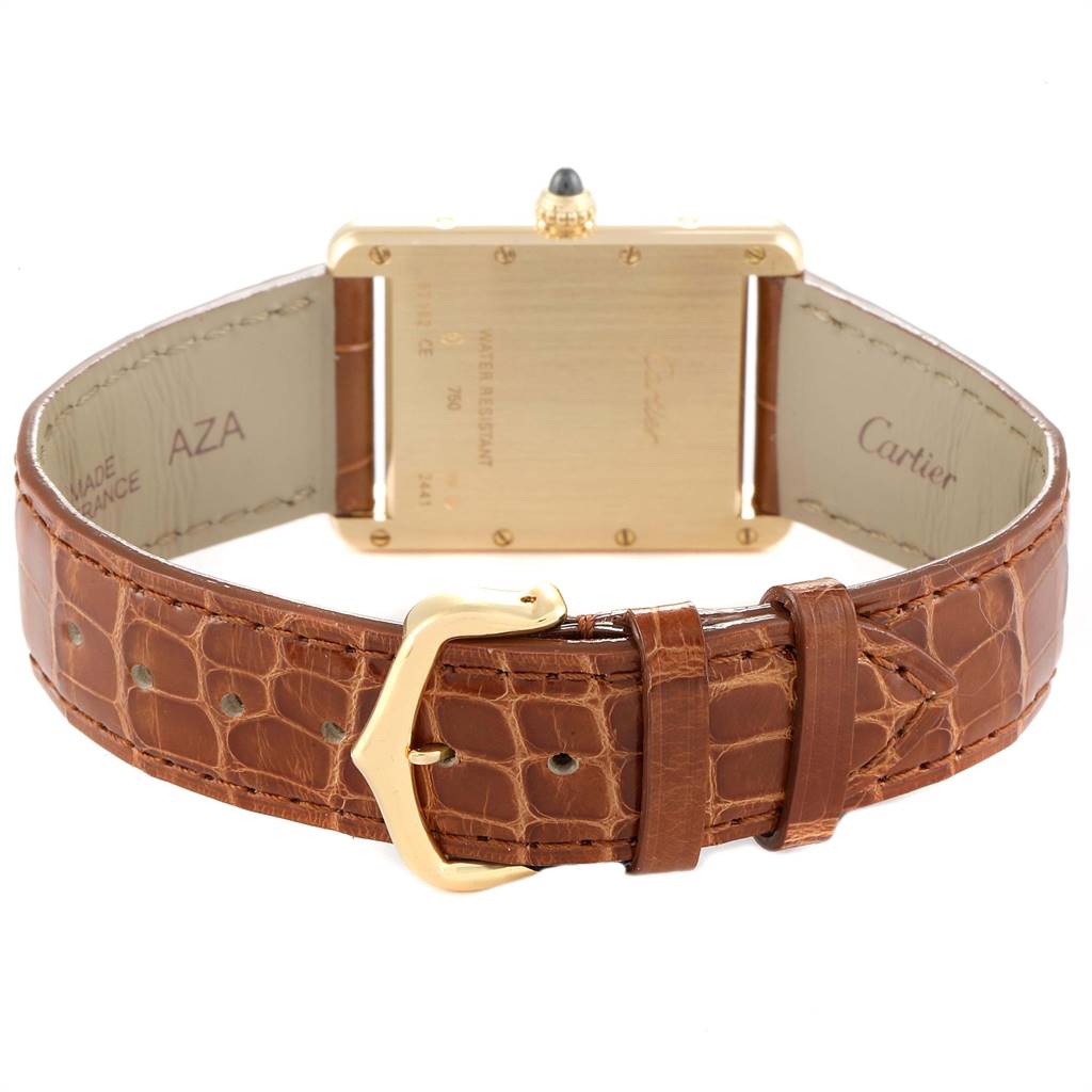 The image shows the back view of a Cartier Tank Louis W1529756 Men
s Yellow Gold Silver Dial W1529756 Men
s Yellow Gold Silver Dial model watch, featuring the case back and brown leather strap.