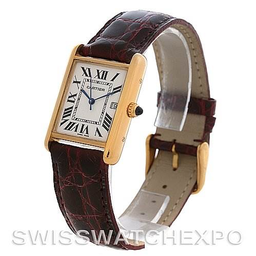 The Cartier Tank Louis W1529756 Yellow Gold White Dial W1529756 Yellow Gold White Dial watch is shown at a three-quarter angle, displaying its rectangular face, Roman numerals, leather strap, and gold casing.