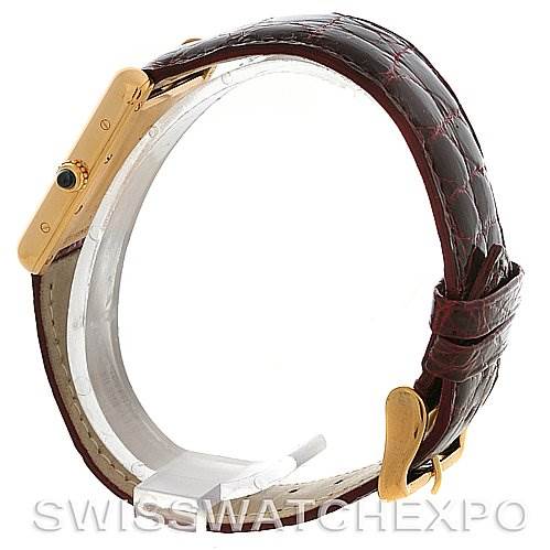 The image shows a side view of a Cartier Tank Louis W1529756 Yellow Gold White Dial W1529756 Yellow Gold White Dial model watch, focusing on its case, crown, and leather strap.