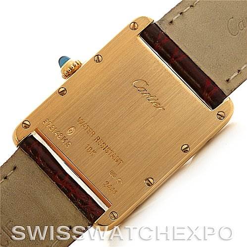 The image shows the back view of a Cartier Tank Louis W1529756 Yellow Gold White Dial W1529756 Yellow Gold White Dial watch, highlighting the gold case, serial number, and the leather strap.