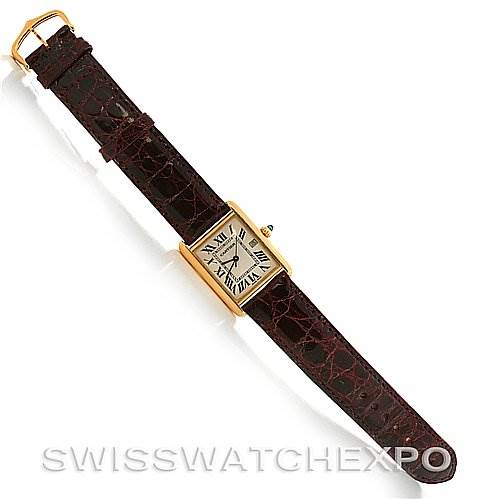 The image shows a top view of the Cartier Tank Louis W1529756 Yellow Gold White Dial W1529756 Yellow Gold White Dial model watch, including its face and brown leather strap.