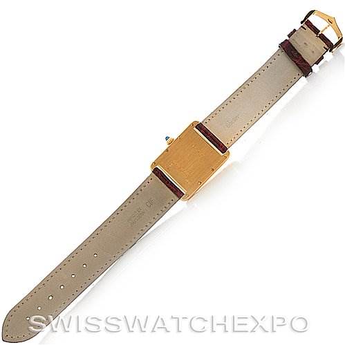 The image shows the back view of a Cartier Tank Louis W1529756 Yellow Gold White Dial W1529756 Yellow Gold White Dial watch lying flat, displaying its strap and clasp.