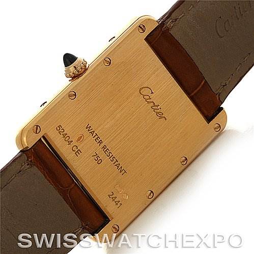 This image shows the back of a Tank Louis model by Cartier, displaying the case back, screws, water resistance details, and leather strap.