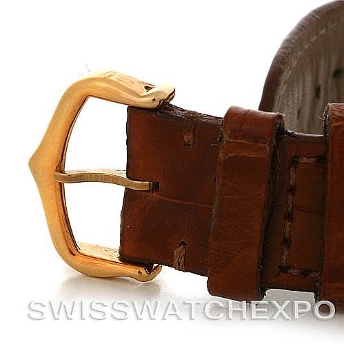 This image shows a close-up of the buckle on a brown leather strap for the Cartier Tank Louis W1529756 Yellow Gold White Dial W1529756 Yellow Gold White Dial watch.