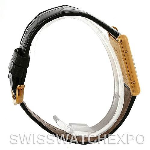 This image shows a side profile of the Cartier Tank Louis W1529756 Men
s Yellow Gold Silver Dial W1529756 Men
s Yellow Gold Silver Dial watch, highlighting its black strap and gold case.