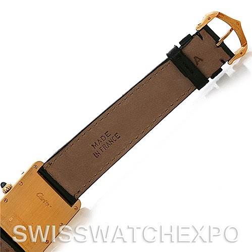 The image shows the back of the Cartier Tank Louis W1529756 Men
s Yellow Gold Silver Dial W1529756 Men
s Yellow Gold Silver Dial watch, focusing on the leather strap and gold buckle, with “MADE IN FRANCE” visible.