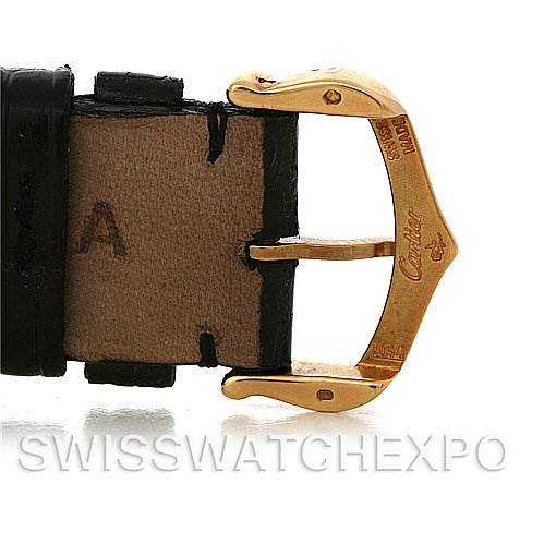 This image shows a close-up of the gold buckle and part of the leather strap of a Cartier Tank Louis W1529756 Men
s Yellow Gold Silver Dial W1529756 Men
s Yellow Gold Silver Dial watch.