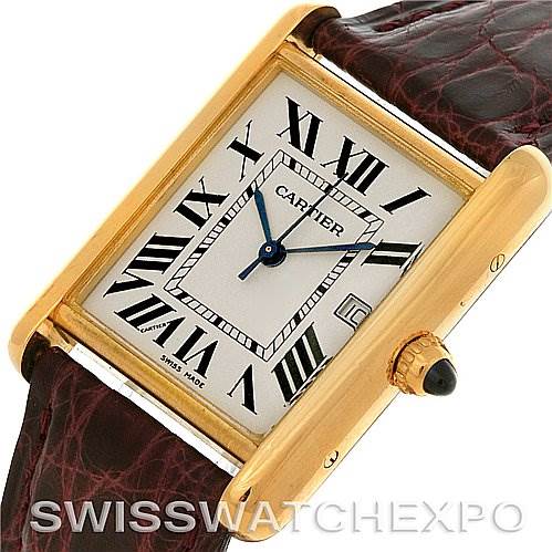The image shows a close-up angle of the Cartier Tank Louis W1529756 Men
s Yellow Gold Silver Dial W1529756 Men
s Yellow Gold Silver Dial watch, highlighting its square dial, Roman numerals, blue hands, and leather strap.