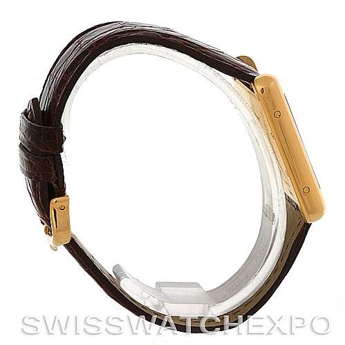 This image shows a side view of a Cartier Tank Louis W1529756 Men
s Yellow Gold Silver Dial W1529756 Men
s Yellow Gold Silver Dial watch, highlighting its casing and leather strap.