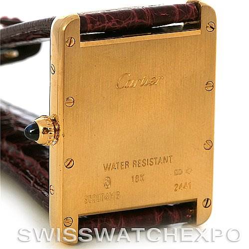 The image shows the backside of the Cartier Tank Louis W1529756 Men
s Yellow Gold Silver Dial W1529756 Men
s Yellow Gold Silver Dial watch, highlighting its water resistance and 18K gold casing.