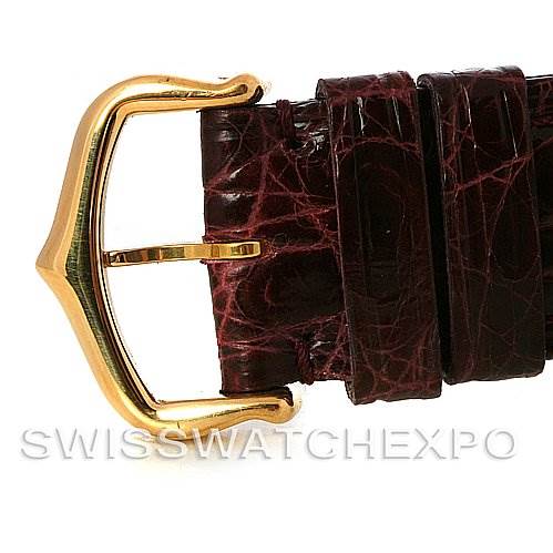 The image shows a close-up of the gold buckle and brown leather strap of a Cartier Tank Louis W1529756 Men
s Yellow Gold Silver Dial W1529756 Men
s Yellow Gold Silver Dial watch.