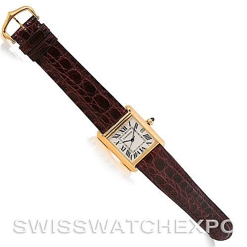 The image shows a Cartier Tank Louis W1529756 Men
s Yellow Gold Silver Dial W1529756 Men
s Yellow Gold Silver Dial watch laid flat, showcasing its brown leather strap and rectangular gold case from a top-down angle.