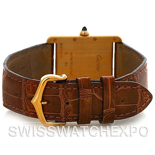 This image shows the back view of a Cartier Tank Louis W1529756 Men
s Yellow Gold Silver Dial W1529756 Men
s Yellow Gold Silver Dial watch, highlighting the leather strap and gold buckle.