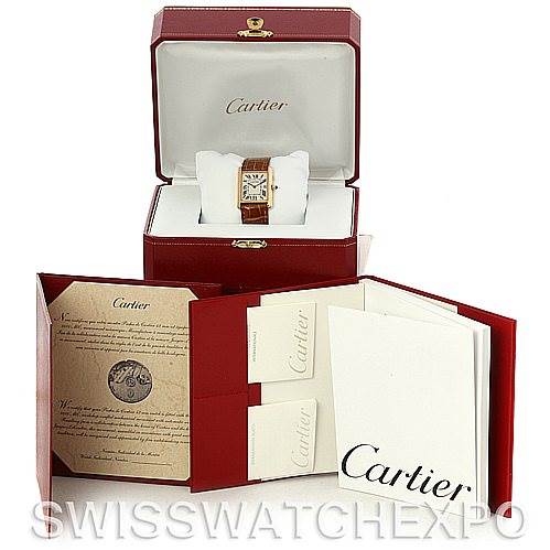 The image shows a Cartier Tank Louis W1529756 Men
s Yellow Gold Silver Dial W1529756 Men
s Yellow Gold Silver Dial watch in its open box, with accompanying documents and booklets displayed in front.