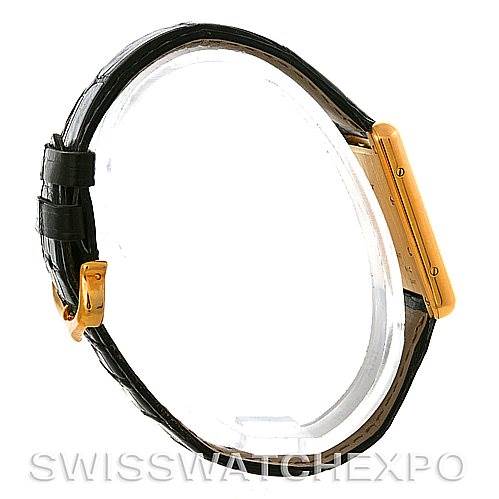 Side view of the Cartier Tank Louis W1529756 Men
s Yellow Gold Silver Dial W1529756 Men
s Yellow Gold Silver Dial watch, showing the case, crown, and black leather strap with buckle.