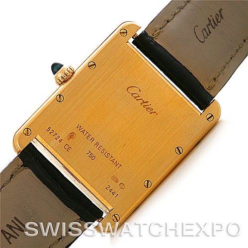 The image shows the back casing of a Cartier Tank Louis W1529756 Men
s Yellow Gold Silver Dial W1529756 Men
s Yellow Gold Silver Dial watch, highlighting its markings and leather straps.
