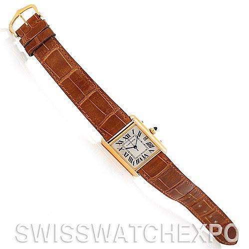 The image shows a top-down view of a Cartier Tank Louis W1529756 Men
s Yellow Gold Silver Dial W1529756 Men
s Yellow Gold Silver Dial watch with a brown leather strap and a rectangular face.