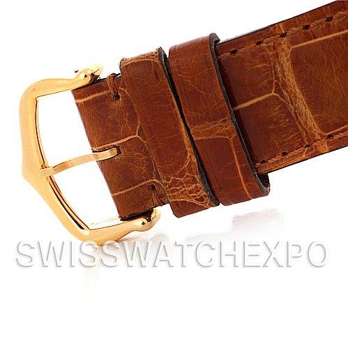 The image shows the leather strap and gold buckle of a Cartier Tank Louis W1529756 Men
s Yellow Gold Silver Dial W1529756 Men
s Yellow Gold Silver Dial watch from a side angle.