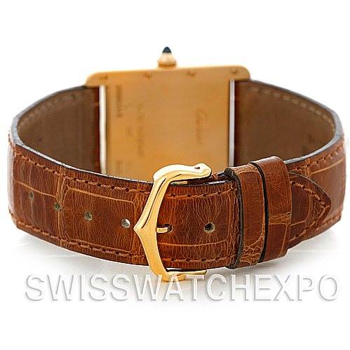 The angle shows the back case and leather strap with the buckle of the Cartier Tank Louis W1529756 Men
s Yellow Gold Silver Dial W1529756 Men
s Yellow Gold Silver Dial model watch.