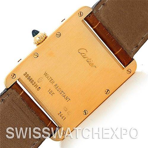 The image shows the back case of a Cartier Tank Louis W1529756 Men
s Yellow Gold Silver Dial W1529756 Men
s Yellow Gold Silver Dial watch, highlighting the brand, model, water resistance, and 18k gold marking.