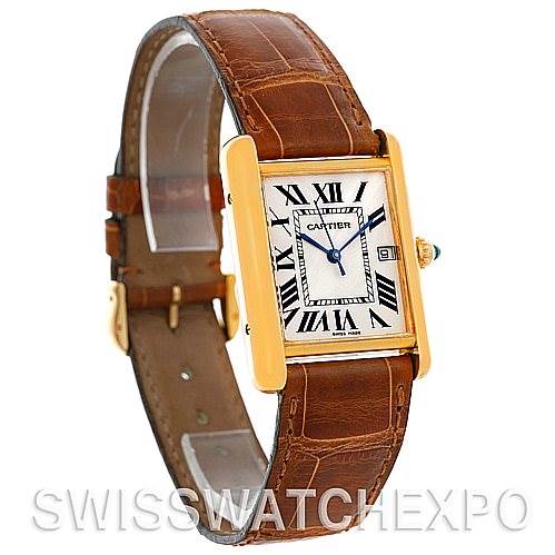The image shows a Cartier Tank Louis W1529756 Men
s Yellow Gold Silver Dial W1529756 Men
s Yellow Gold Silver Dial watch at a three-quarter angle, highlighting its rectangular face, brown leather strap, and gold casing.