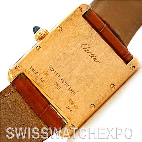 The image shows the back case of a Cartier Tank Louis W1529756 Men
s Yellow Gold Silver Dial W1529756 Men
s Yellow Gold Silver Dial model, highlighting the brand, water resistance, serial number, and leather strap.