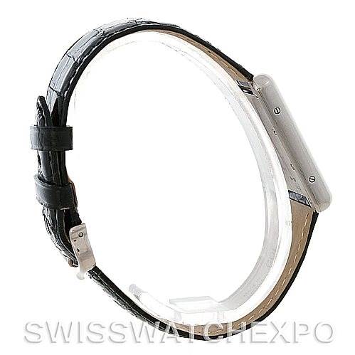 The image shows a side profile view of the Tank Louis Cartier watch, highlighting its black leather strap and the thin case.