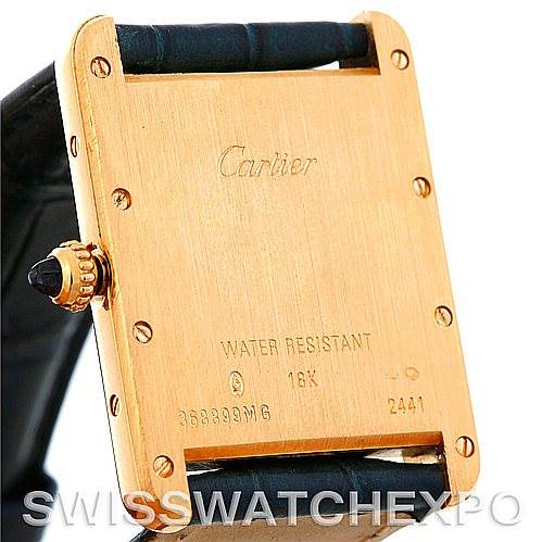 This image shows the back of a Cartier Tank Louis W1529756 Men
s Yellow Gold Silver Dial W1529756 Men
s Yellow Gold Silver Dial watch, highlighting the case back, screws, inscriptions, and part of the strap.