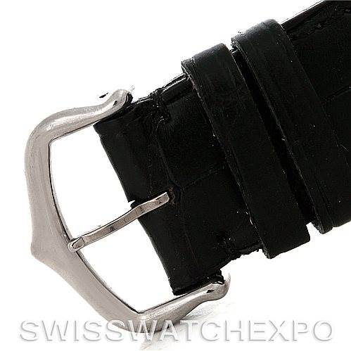 The image displays a close-up of the buckle and strap of the Tank Louis model by Cartier.