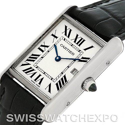 The image shows a close-up of the Tank Louis model by Cartier from a three-quarter angle, highlighting the watch face, crown, and part of the strap.