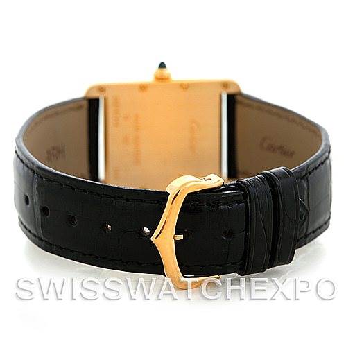 The image shows the back and buckle of a Cartier Tank Louis W1529756 Men
s Yellow Gold Silver Dial W1529756 Men
s Yellow Gold Silver Dial watch, focusing on the black leather strap and gold buckle.