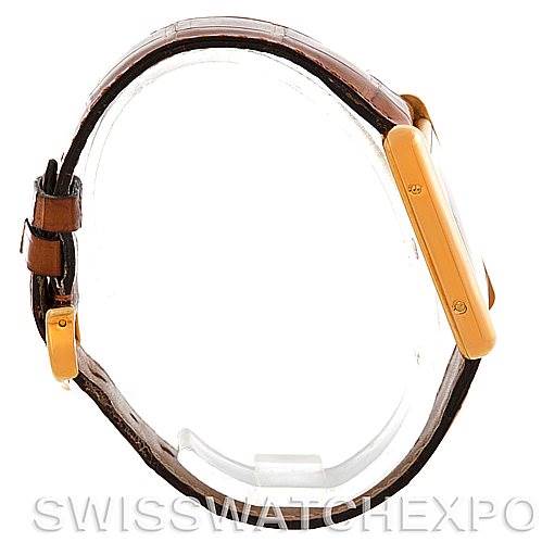 The image shows a side view of the Cartier Tank Louis W1529756 Men's Yellow Gold Silver Dial W1529756 Men's Yellow Gold Silver Dial model, highlighting its gold case and brown leather strap.