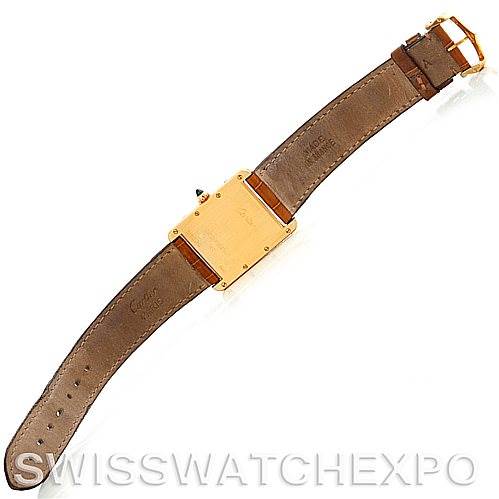 The image shows the back side of a Cartier Tank Louis W1529756 Men's Yellow Gold Silver Dial W1529756 Men's Yellow Gold Silver Dial watch, displaying the leather strap and the case back.