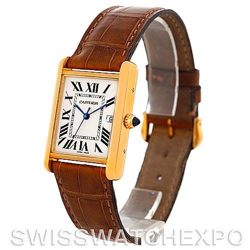 Shown at a three-quarter angle, the Cartier Tank Louis W1529756 Men's Yellow Gold Silver Dial W1529756 Men's Yellow Gold Silver Dial watch displays its rectangular face, Roman numerals, and brown leather strap.