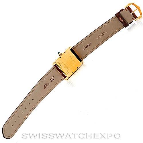 This image shows the underside of a Cartier Tank Louis W1529756 Men's Yellow Gold Silver Dial W1529756 Men's Yellow Gold Silver Dial watch, highlighting the strap, buckle, and caseback.