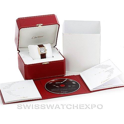 The image shows a Cartier Tank Louis W1529756 Men's Yellow Gold Silver Dial W1529756 Men's Yellow Gold Silver Dial watch in its open box, along with its packaging, manual, and a CD.