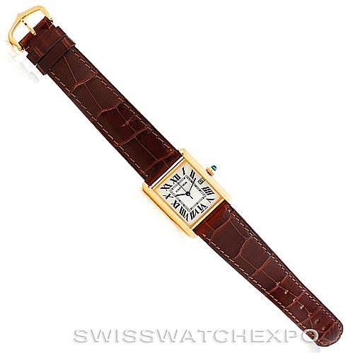 The image shows a top-down view of a Cartier Tank Louis W1529756 Men's Yellow Gold Silver Dial W1529756 Men's Yellow Gold Silver Dial watch with a brown leather strap and gold casing.