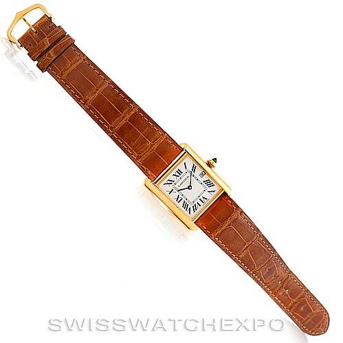The image shows a top-down view of the Tank Louis watch by Cartier, displaying the entire watch and its leather strap.