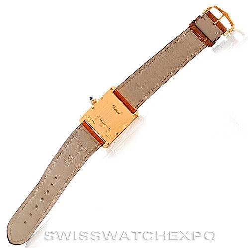The image shows the back view of a Cartier Tank Louis W1529756 Men's Yellow Gold Silver Dial W1529756 Men's Yellow Gold Silver Dial watch, displaying the strap and the case back with branding.