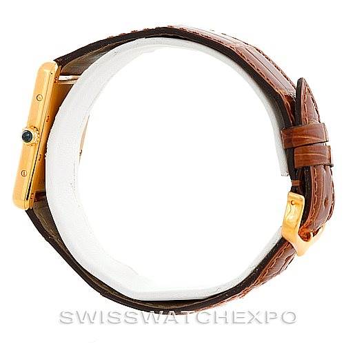 The image shows a side view of the Cartier Tank Louis W1529756 Men's Yellow Gold Silver Dial W1529756 Men's Yellow Gold Silver Dial watch, highlighting its brown leather strap and gold casing.