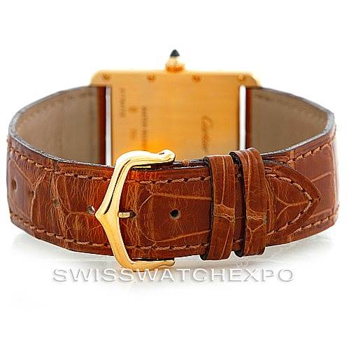 The image shows the back view of a Cartier Tank Louis W1529756 Men's Yellow Gold Silver Dial W1529756 Men's Yellow Gold Silver Dial watch, highlighting its brown leather strap and gold-tone buckle.