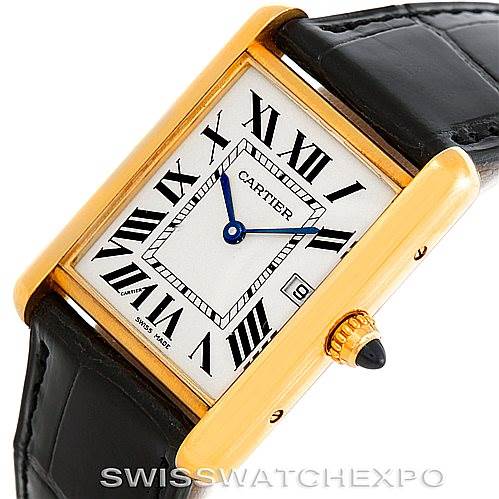 The image shows an angled view of a Cartier Tank Louis W1529756 Men's Yellow Gold Silver Dial W1529756 Men's Yellow Gold Silver Dial watch, highlighting its rectangular face, Roman numerals, and gold casing with a black leather strap.