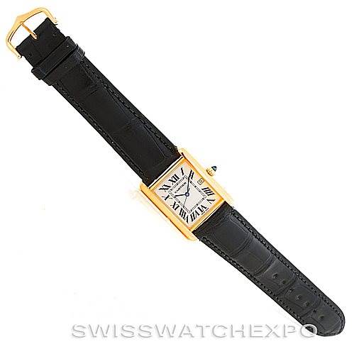 The image shows a top-down view of the Cartier Tank Louis W1529756 Men's Yellow Gold Silver Dial W1529756 Men's Yellow Gold Silver Dial model, displaying its face, black leather strap, and gold buckle.