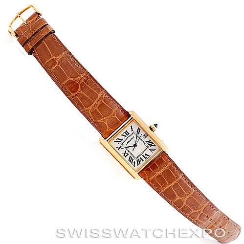 The image shows a top-down view of a Cartier Tank Louis W1529756 Men's Yellow Gold Silver Dial W1529756 Men's Yellow Gold Silver Dial watch with a brown leather strap and gold rectangular case.