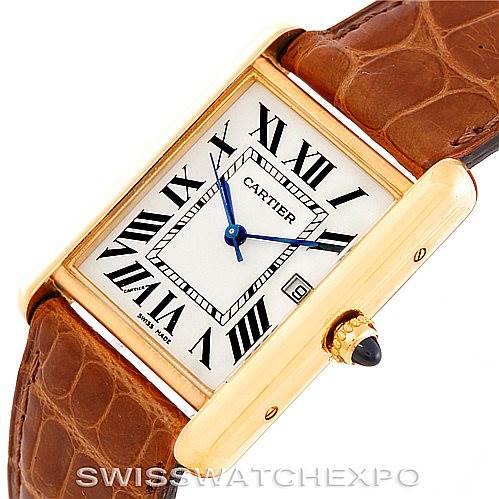 This image shows the face and strap of a Tank Louis Cartier watch, highlighting its rectangular dial, Roman numerals, and brown leather strap.