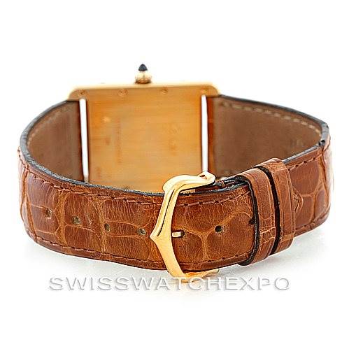 The image shows the Cartier Tank Louis W1529756 Men's Yellow Gold Silver Dial W1529756 Men's Yellow Gold Silver Dial watch from the back, highlighting its brown leather strap and gold buckle.