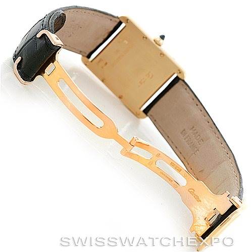 This image shows the back of a Tank Louis model watch by Cartier, highlighting the straps and the clasp mechanism.
